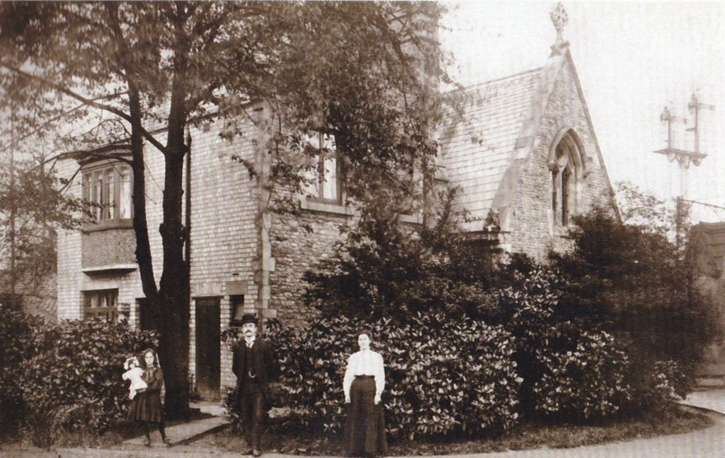 Michael Kelly and family standing outside the back of the lodge in HGC