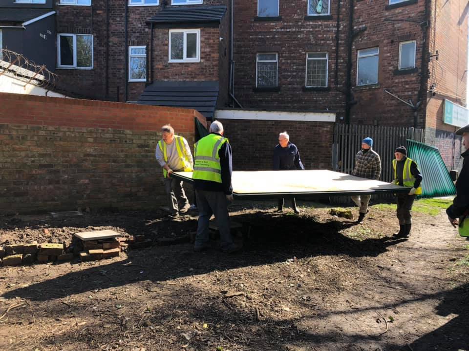 Volunteers erecting the unit