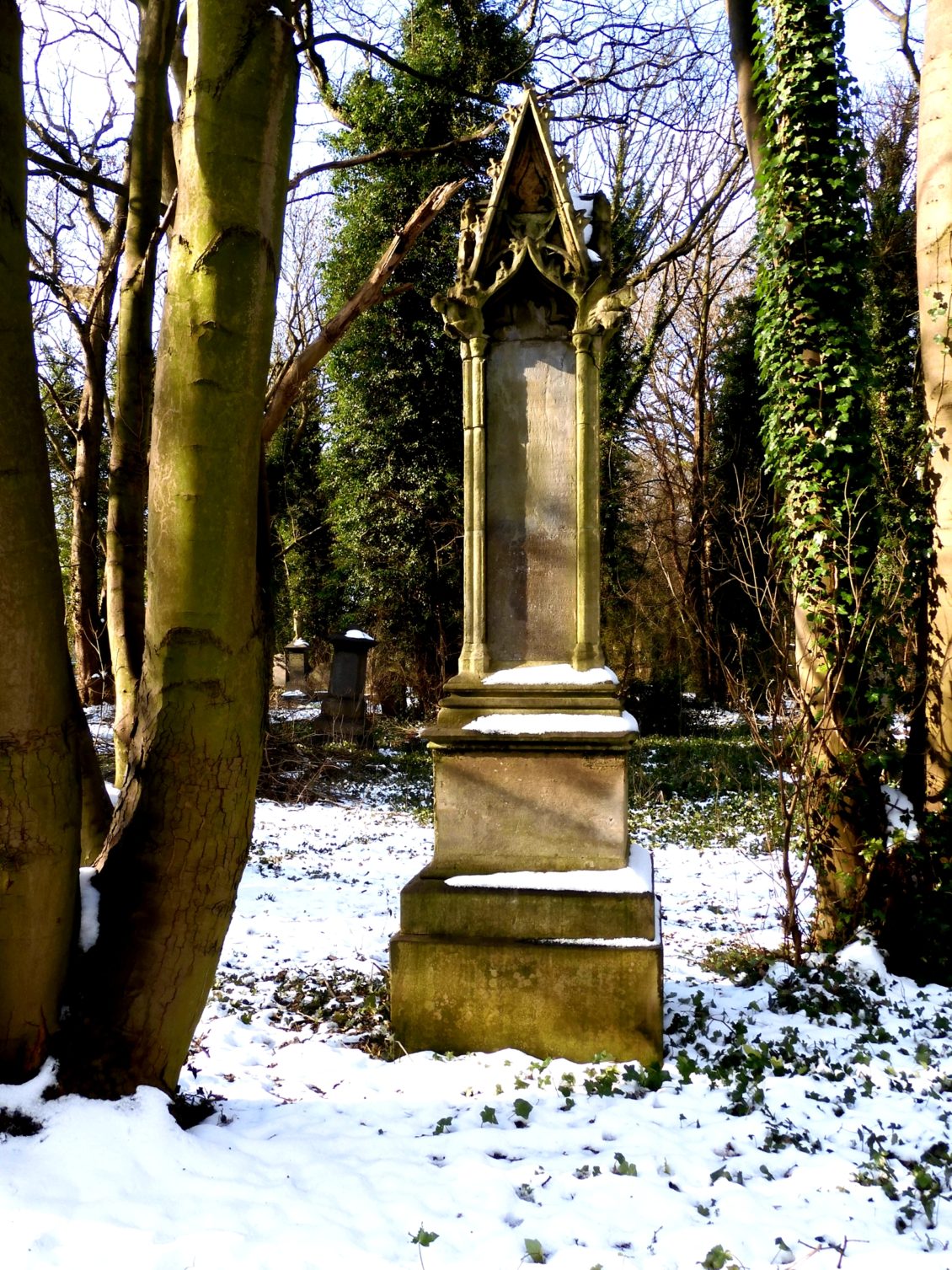 Image of headstone in snow