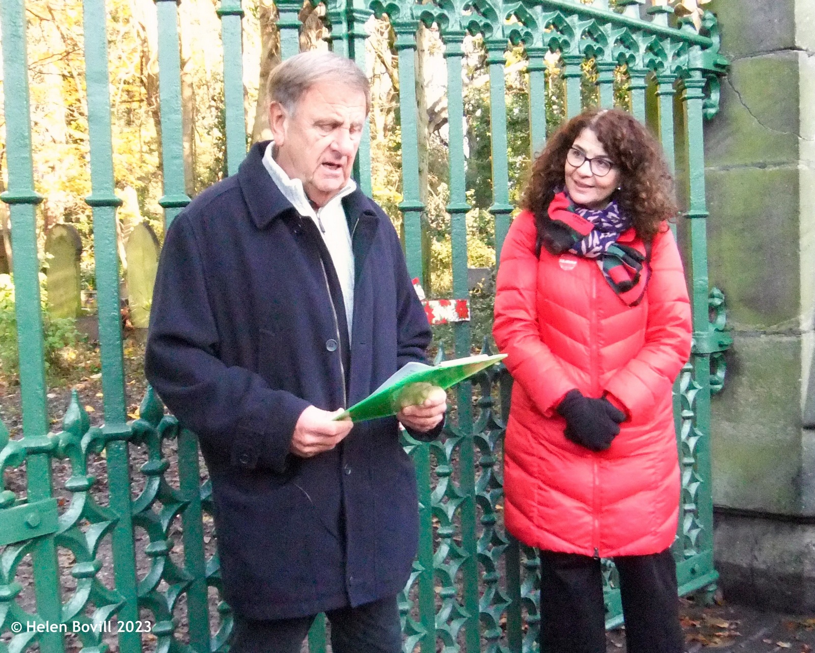 Bill Longbone giving a brief history of the cemetery gates, watched by Dame Diana Johnson MP